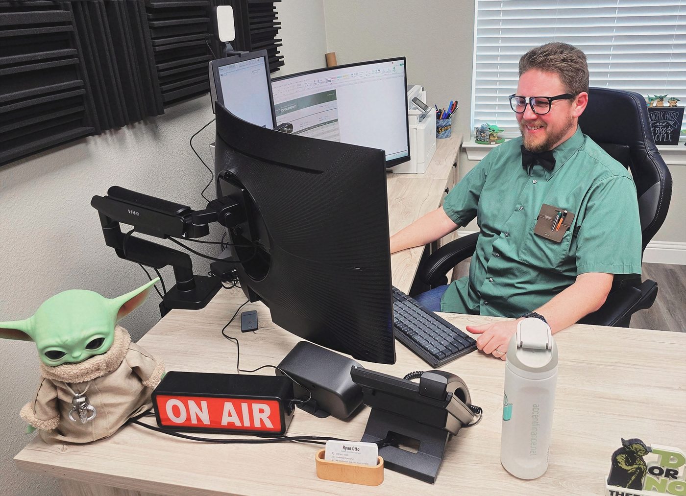 Ryan Otto at the recording desk, ON AIR sign lit