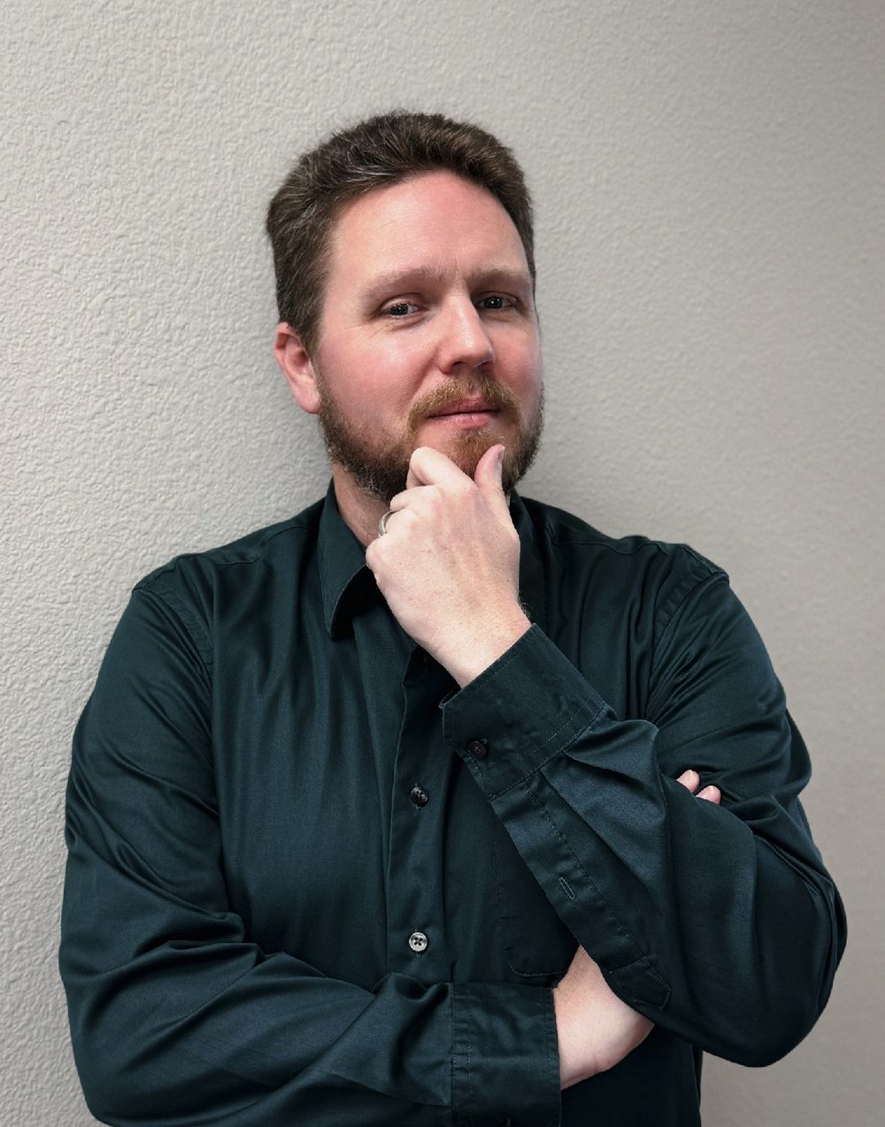 Ryan Otto, hand to his chin, mid-thought