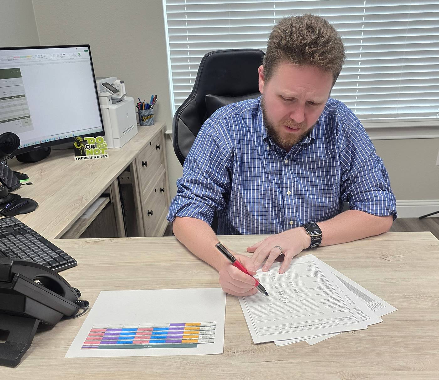 Ryan Otto working through figures at his desk